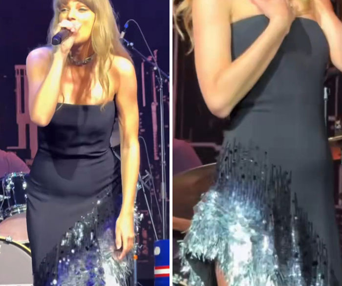 Taylor Swift performing on stage in a black dress, fueling Taylor Swift pregnant speculation.