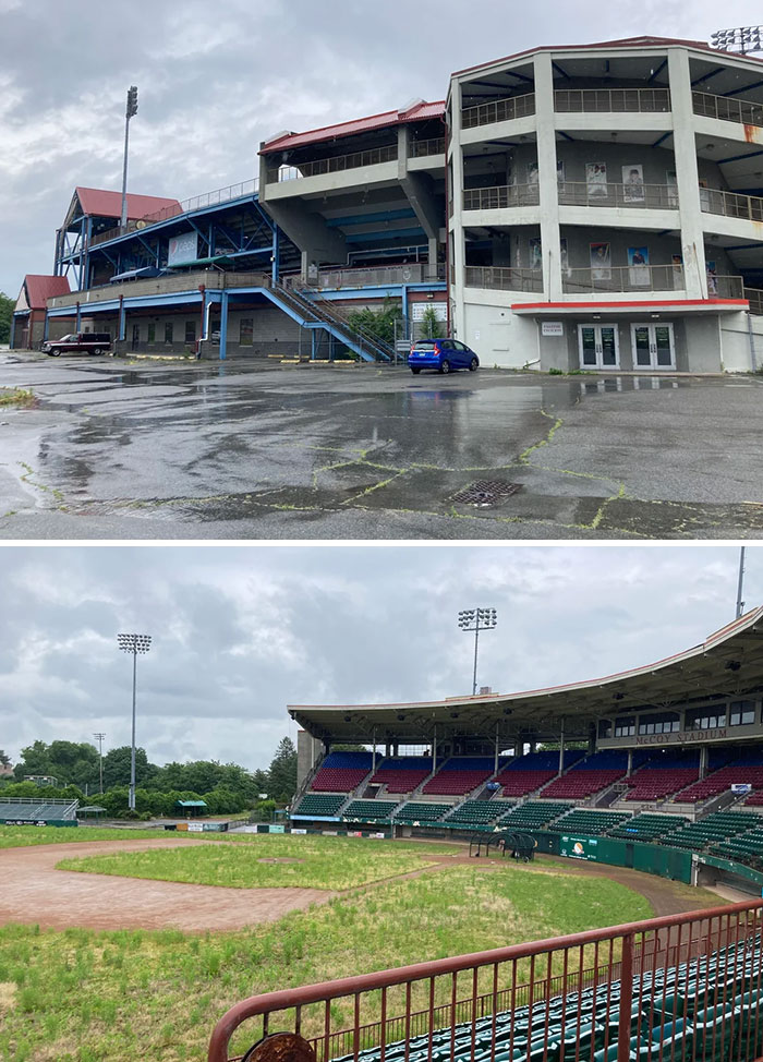 Abandoned stadium with cracked pavement and empty parking under overcast sky urban exploration