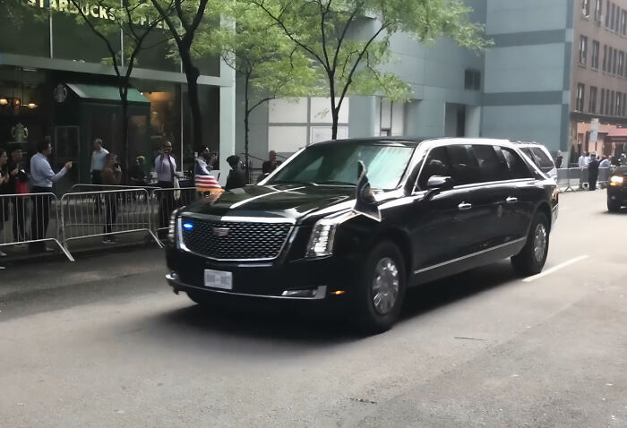 Black presidential limousine on street related to White House medical secrecy