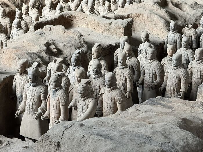 Hundreds of ancient Terracotta Army figures stand in rows, depicting the historical and cultural depth of China.