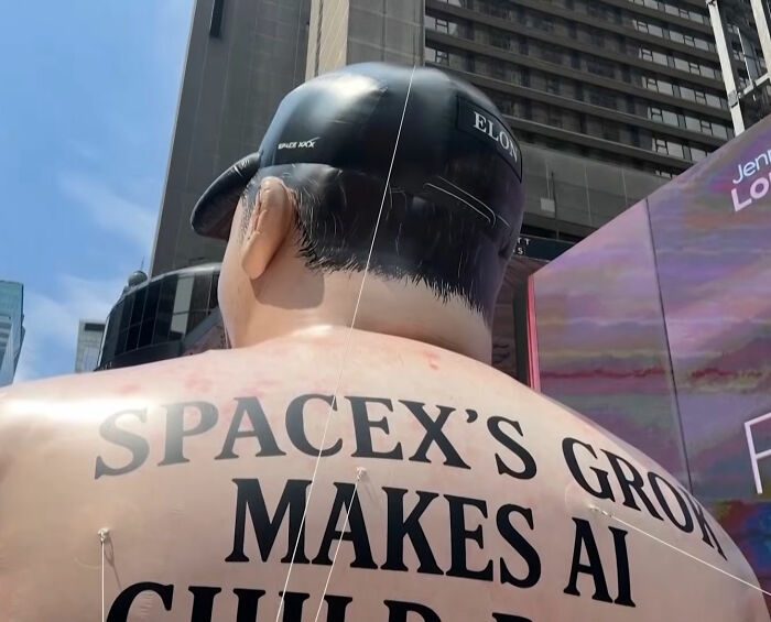 Giant inflatable of Elon Musk with critical message in Times Square