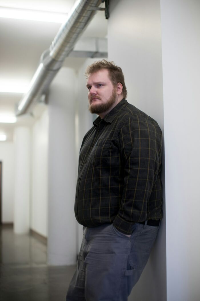 Man standing pensively demonstrating effects on human body