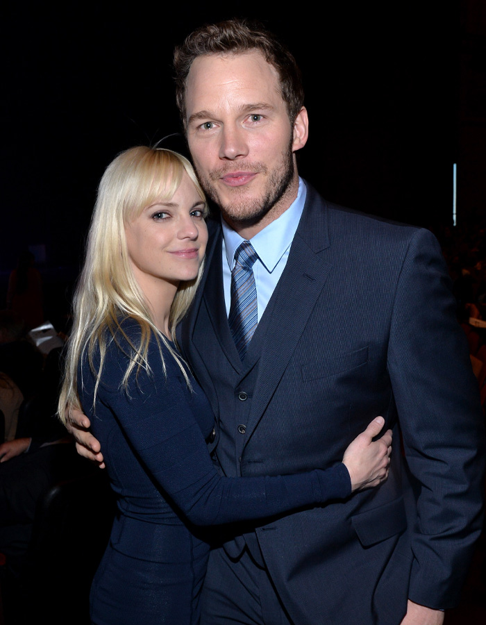 Anna Faris and Chris Pratt embracing at an event in formal attire