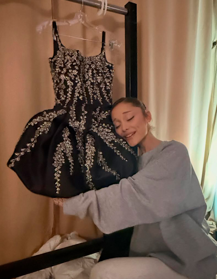 Ariana Grande embracing a detailed, sparkly dress, sparking major concern among fans.