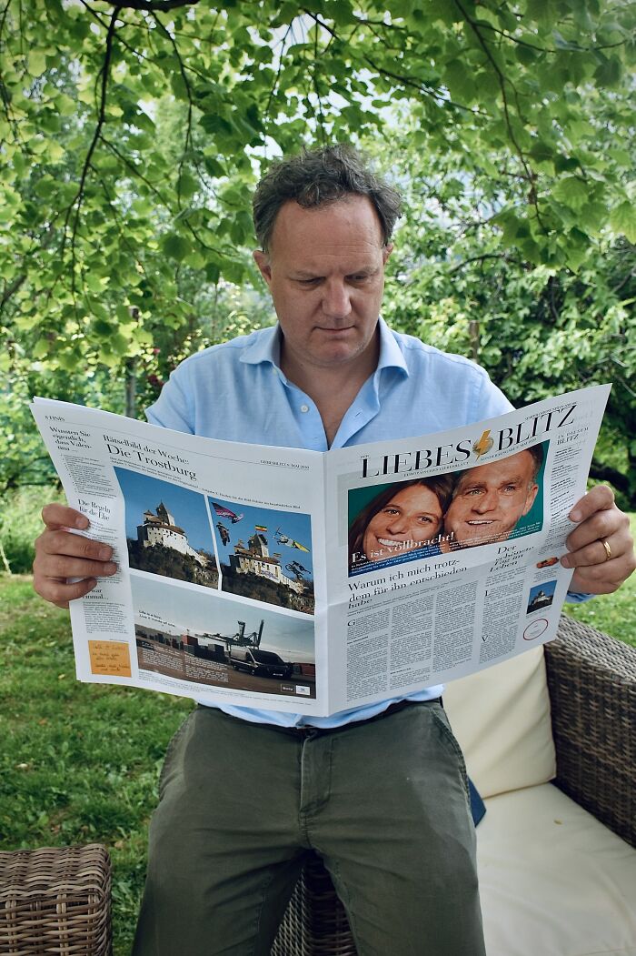 A man reading a newspaper with a headline about a couple, showcasing the reality of exposed double lives.