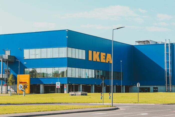 IKEA store exterior, symbolizing an awkward situation related to shopping or home furnishing.
