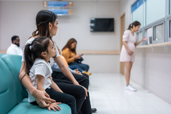 Mother and child waiting together highlighting moments of generosity