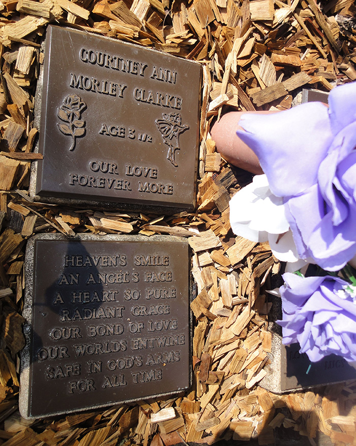 Memorial plaques with flowers commemorating a young victim in Australia