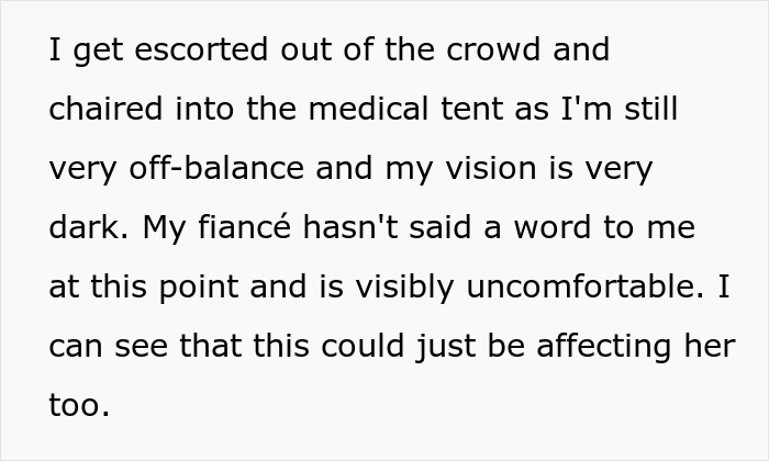 A man escorted to a medical tent after fainting at concert, his fiancée quiet and visibly uncomfortable trying to get closer to the stage. A man escorted to a medical tent after fainting at concert, his fiancée quiet and visibly uncomfortable trying to get closer to the stage.