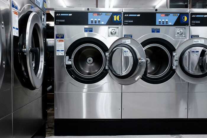 Commercial laundromat with open industrial washing machines