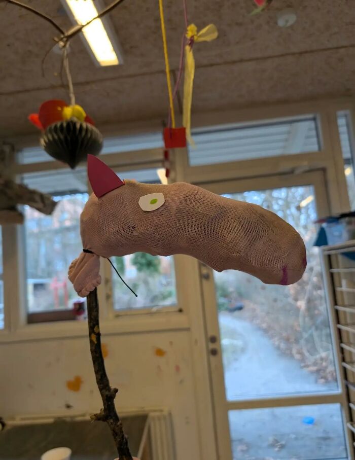 A bizarre, crude Peppa Pig stick puppet in a classroom, very strange indeed.