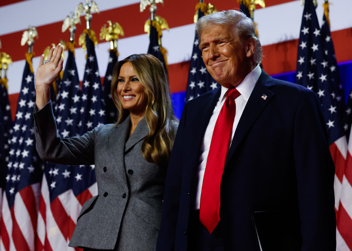 Donald Trump and Melania at an event. This image highlights their White House bedroom doors and habits.