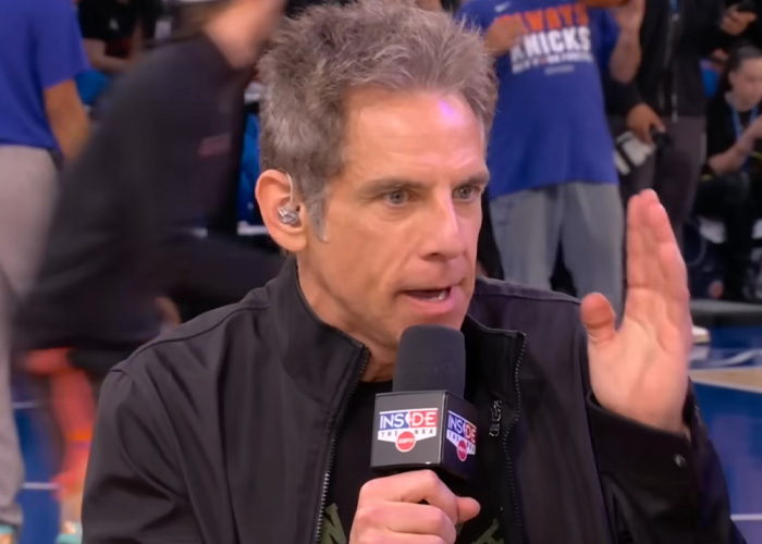 Ben Stiller speaking into a microphone during an event about homelessness Ben Stiller speaking into a microphone during an event about homelessness