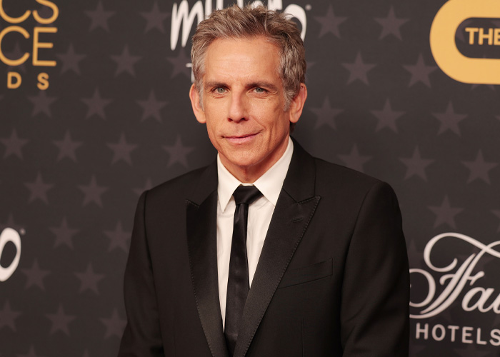 Ben Stiller posing in a black suit at a formal event Ben Stiller posing in a black suit at a formal event