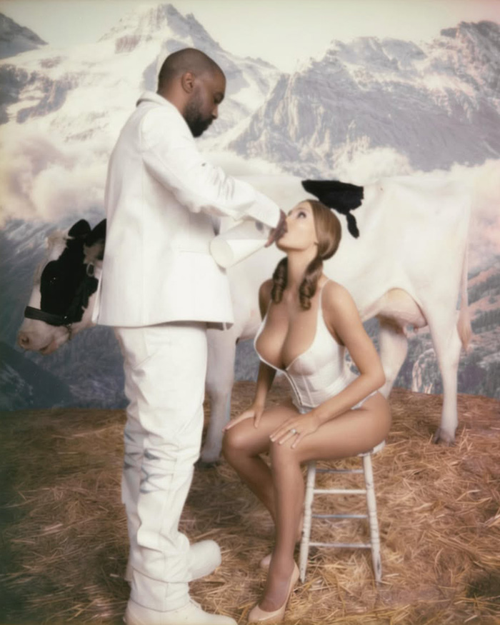 Kanye and Bianca Censori in a raunchy photo shoot, Kanye feeding Bianca milk, with a cow and mountains in the background. Kanye and Bianca Censori in a raunchy photo shoot, Kanye feeding Bianca milk, with a cow and mountains in the background.