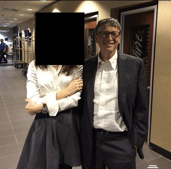 Bill Gates posing with a woman with face blacked out indoors Bill Gates posing with a woman with face blacked out indoors