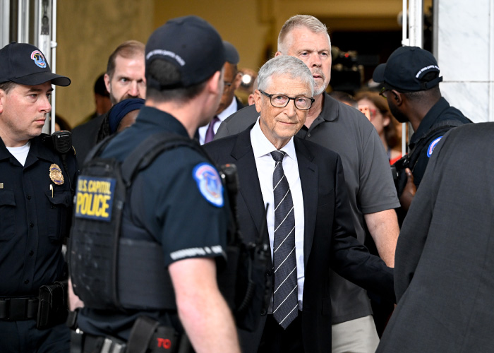 Bill Gates surrounded by US Capitol Police during congressional appearance Bill Gates surrounded by US Capitol Police during congressional appearance