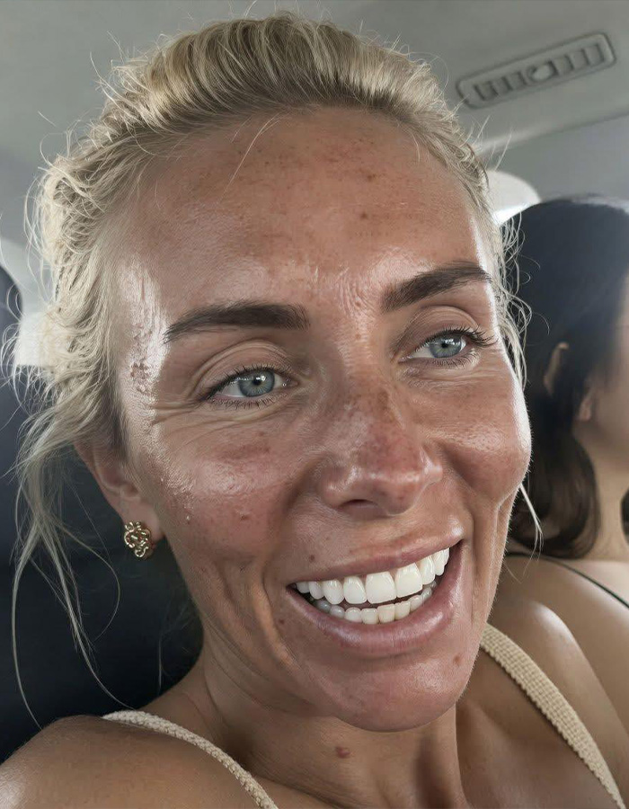 Close-up of Bonnie Blue smiling, showing freckles and natural appearance amid baby shower scandal. Close-up of Bonnie Blue smiling, showing freckles and natural appearance amid baby shower scandal.
