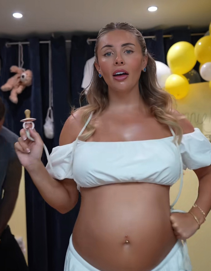 Bonnie Blue holding a pacifier, showing her appearance amid the baby shower scandal. Bonnie Blue holding a pacifier, showing her appearance amid the baby shower scandal.