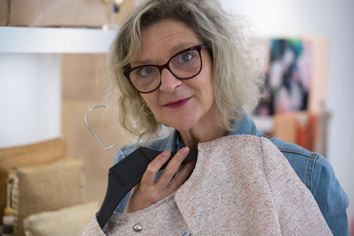 A woman shopping for clothes, resembling the customer who demands another woman's Louis Vuitton bag.