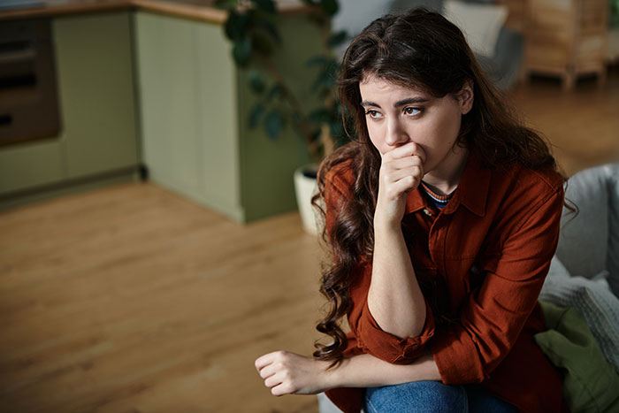 Worried woman contemplates big mistake in wedding planning Worried woman contemplates big mistake in wedding planning