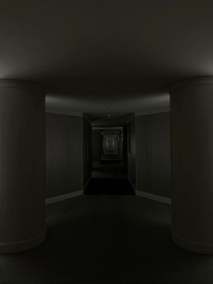 A dark, endless hotel hallway creating a haunting liminal space that you should probably avoid.