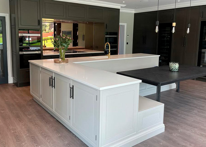 An example of a questionable home renovation with an unusual kitchen island that can devalue homes. An example of a questionable home renovation with an unusual kitchen island that can devalue homes.