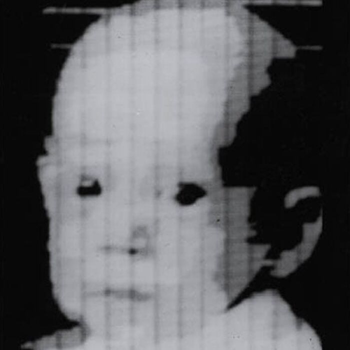 First digital image: a pixelated, high-contrast, black and white historical photo of a baby's face.