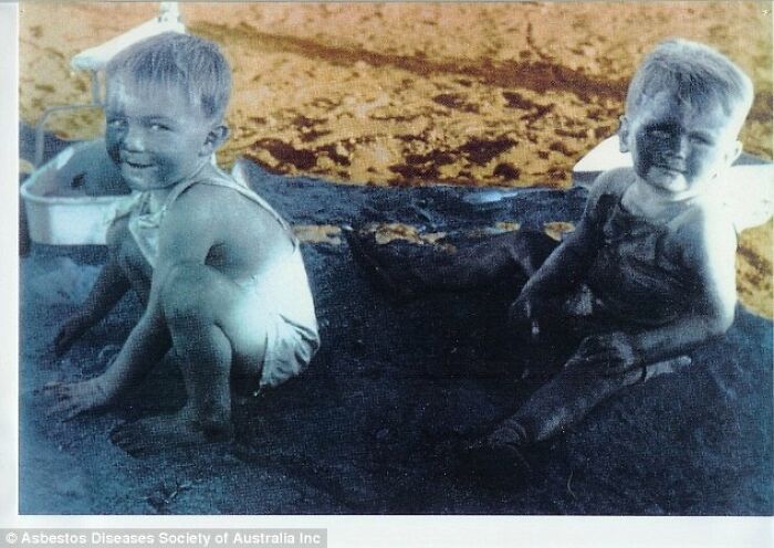 Historical photos of two children covered in mud on the ground, an impossible explanation.