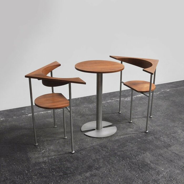 Modern interior design with minimalist wooden chairs and round table