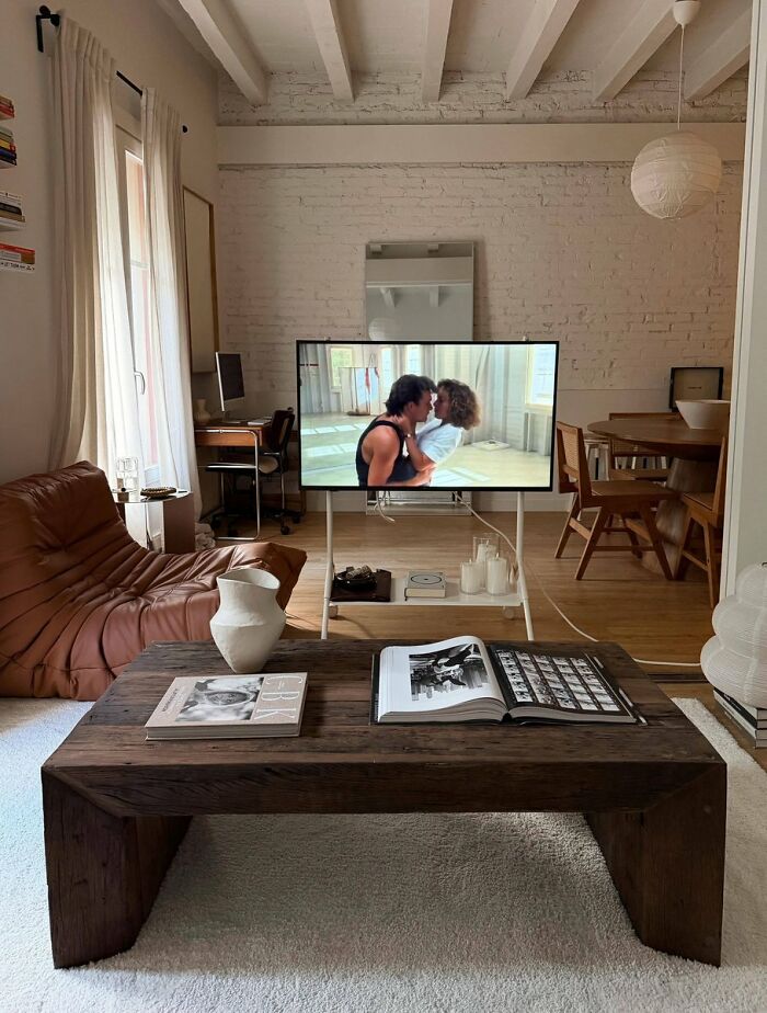 Minimalist living room interior design with wooden coffee table and cozy sofa