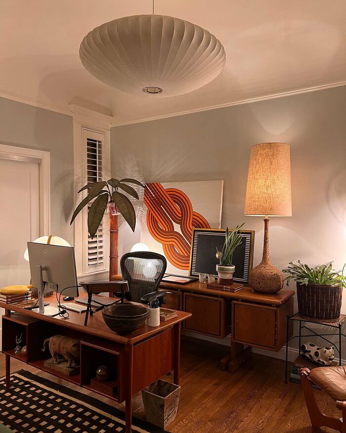 Cozy home office with warm lighting and retro-inspired interior design