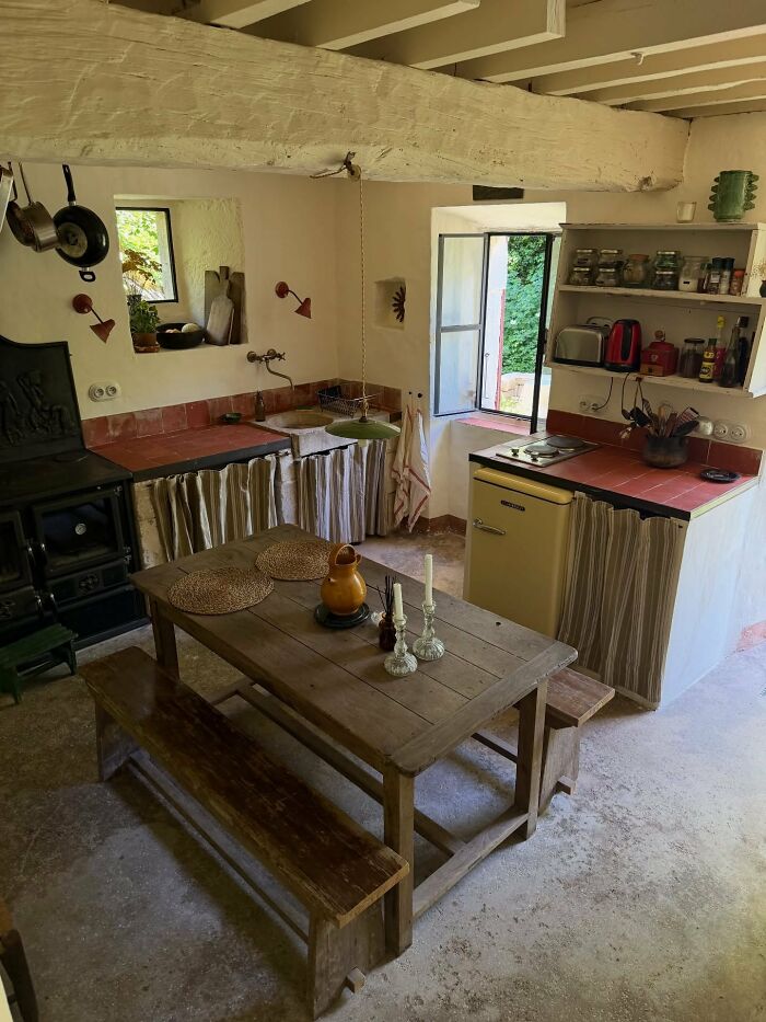 Rustic interior design kitchen with wooden table and vintage stove