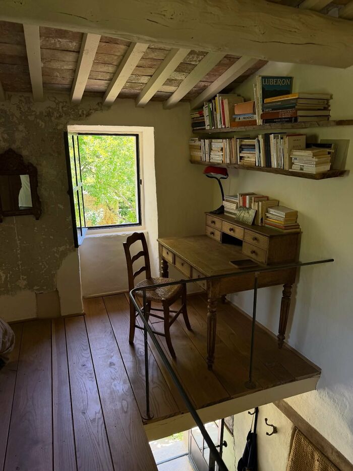 Rustic workspace with wooden desk and books in cozy interior design