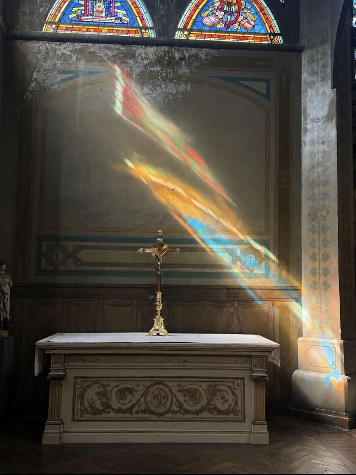 Colorful light reflections on altar in old church interior