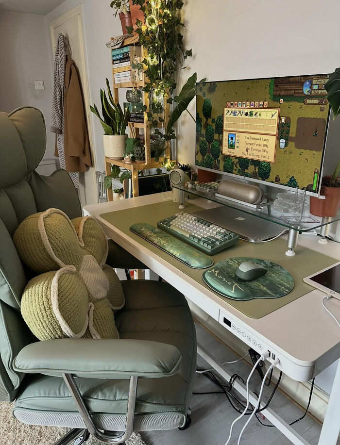Aesthetic home workstation setup with computer and cozy chair