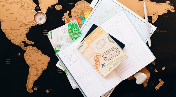 Travel journal and map items on world capitals geography quiz background Travel journal and map items on world capitals geography quiz background