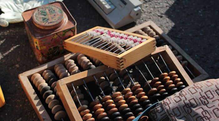 Vintage wooden abacus used for basic math calculations in a quiz challenge Vintage wooden abacus used for basic math calculations in a quiz challenge