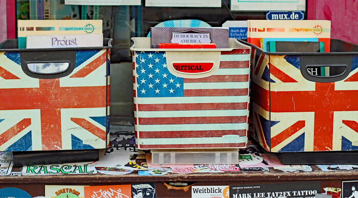 Three storage boxes, two with Union Jack flags and one with an American flag, symbolizing the UK vs US vocabulary test. Three storage boxes, two with Union Jack flags and one with an American flag, symbolizing the UK vs US vocabulary test.