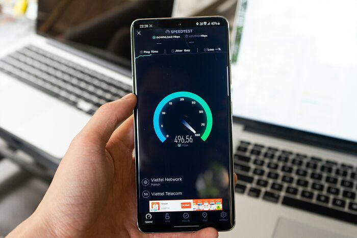 Smartphone showing fast internet speed test results