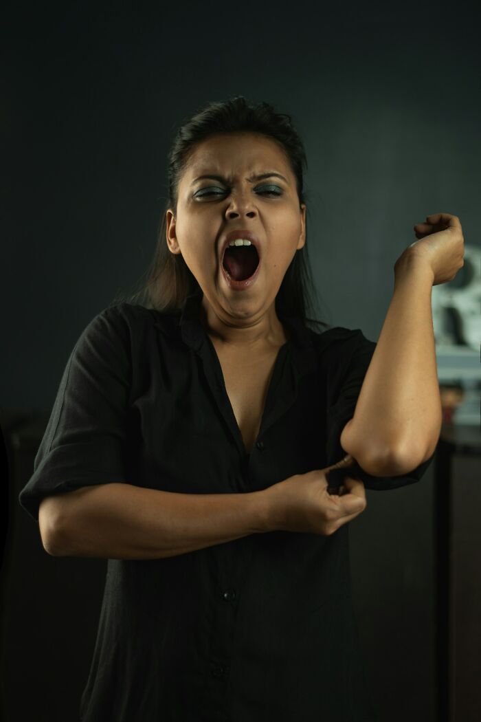 Woman yawning showing human body fatigue fact