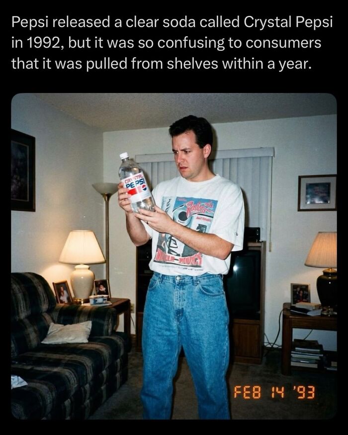Man examining a bottle of Crystal Pepsi clear soda withdrawn after confusing consumers