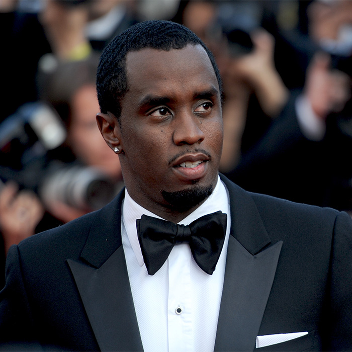 Portrait of Diddy in a tuxedo, reflecting on his troubling history with the Lilo & Stitch actress.