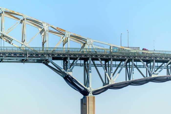 Close-up of a steel bridge structure over waterbody