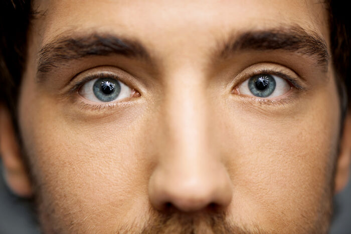 Close up of man's face showing clear blue eyes and skin texture