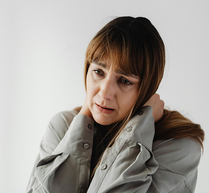 Anxious woman showing relationship red flags