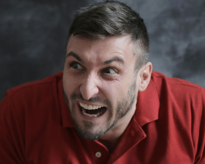 Angry man showing red flags in relationship