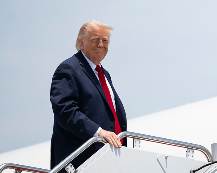 Donald Trump boarding plane related to $14 million project controversy Donald Trump boarding plane related to $14 million project controversy