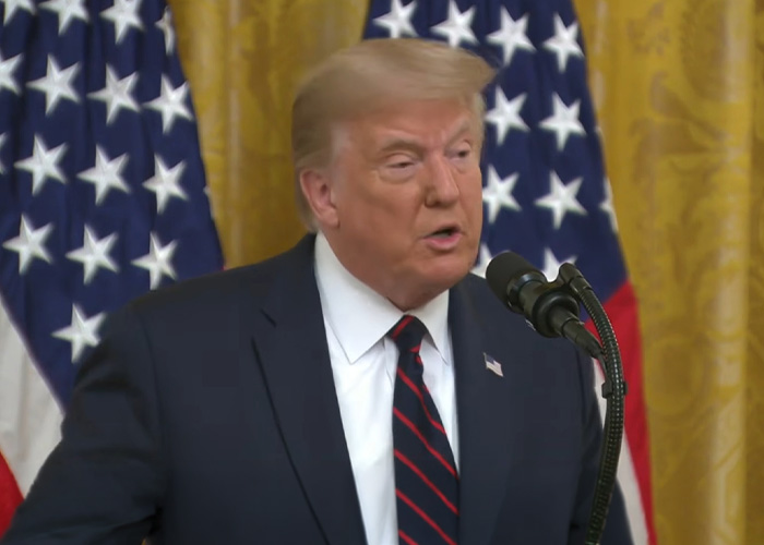 Donald Trump gaffes during a speech in front of American flags, a blooper for history books and YouTube.