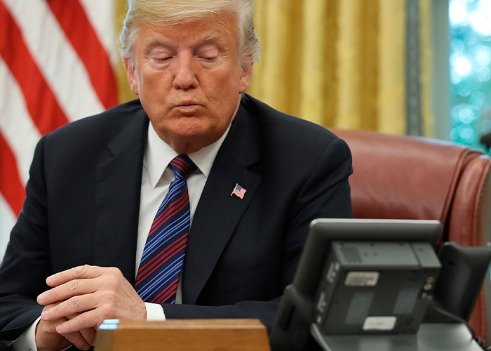Donald Trump gaffes while seated at a desk with eyes closed, a blooper destined for history books and YouTube.